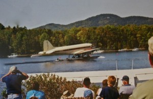 The famous DC-3 takes off at Fly-In some years ago with Lou Hilton and Max Folsom at the controls. Photo courtesy of the Moosehead Historical Society